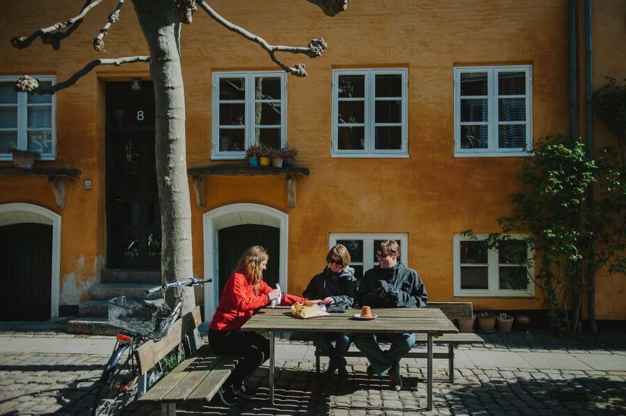 Copenhagen: Hygge and Happiness Culture Walking Tour - Cobblestones, timber-framed houses, and green corners