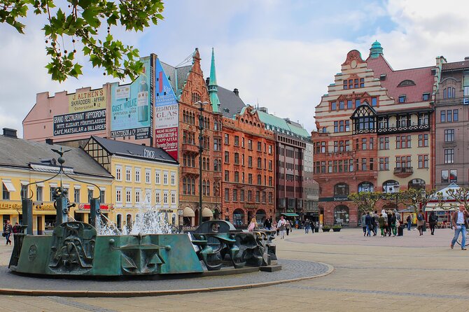 Malmö Full Day Private Trip, Sightseeing Tour & Lunch Option - Castle gardens, the mill, and a view toward Turning Torso